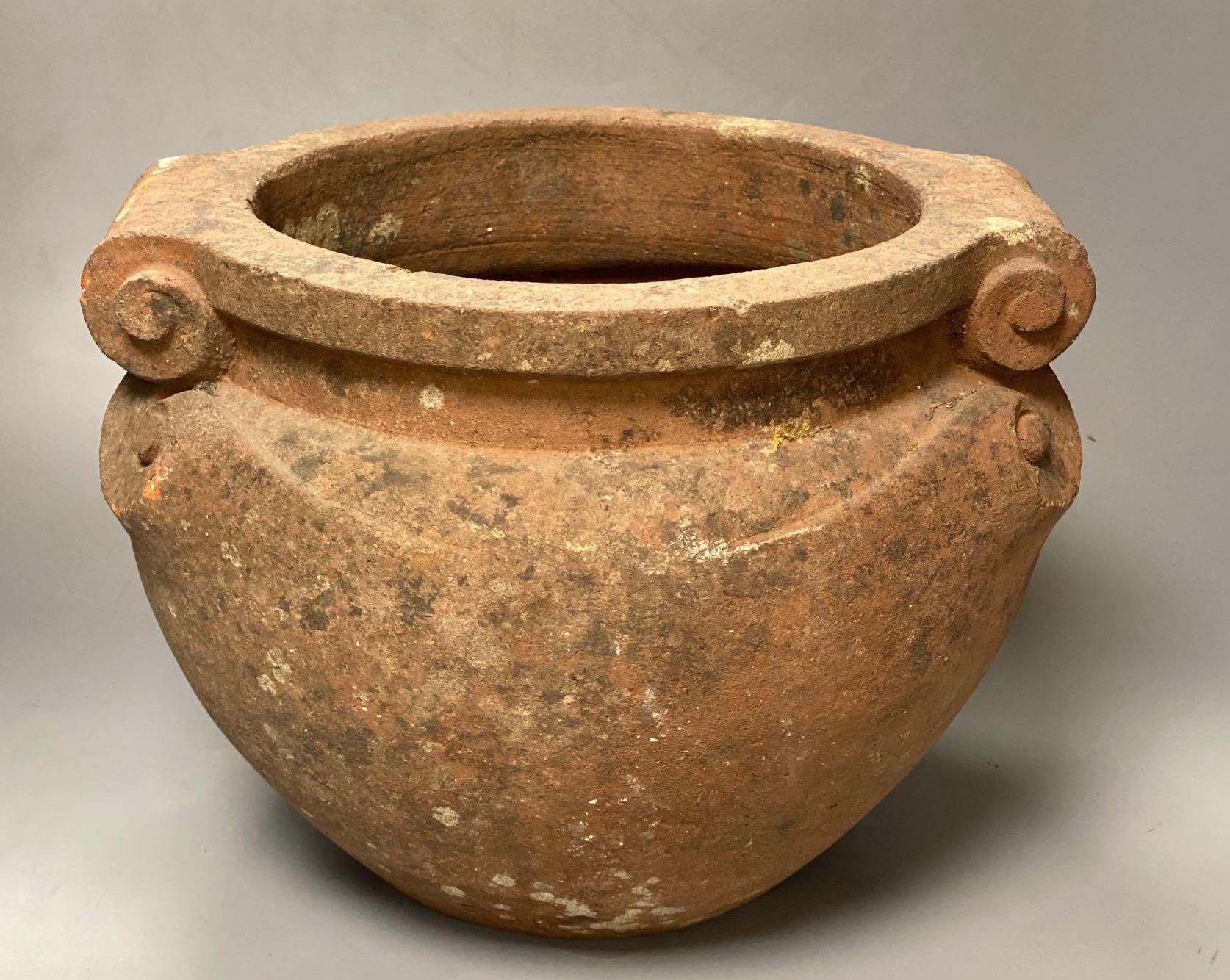 A Compton terracotta scroll pot, initialled N.T., 31cm